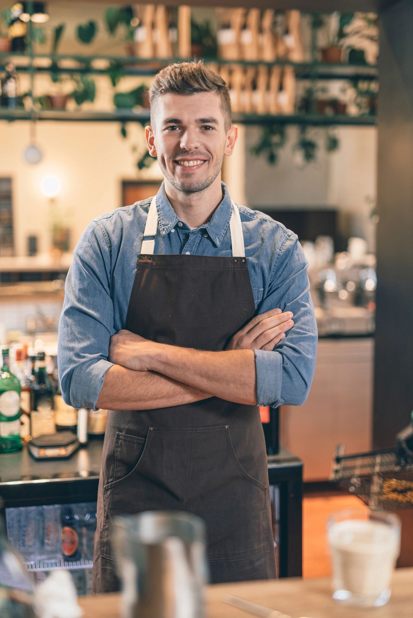 Professional barista standing at the café counter