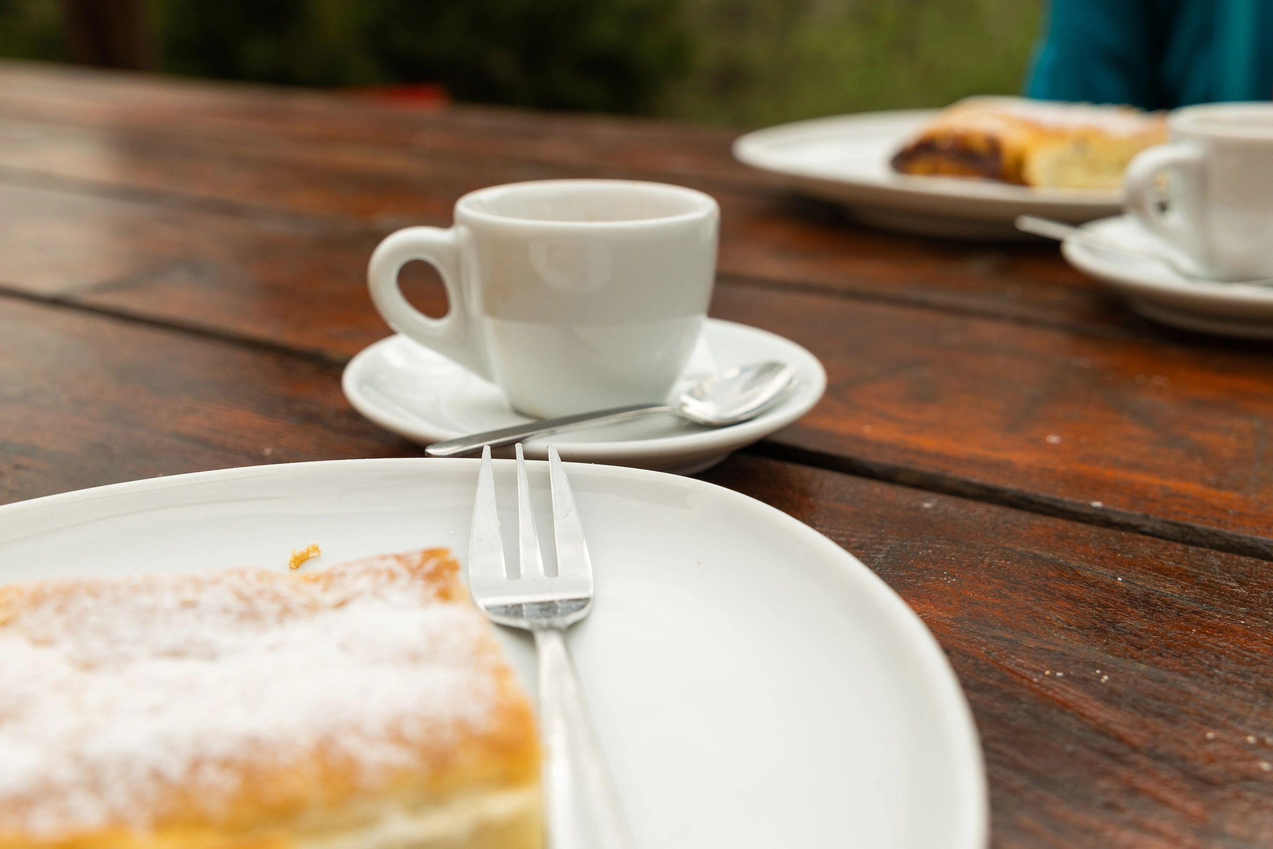 Elegant coffee and pastries arranged on a café table
