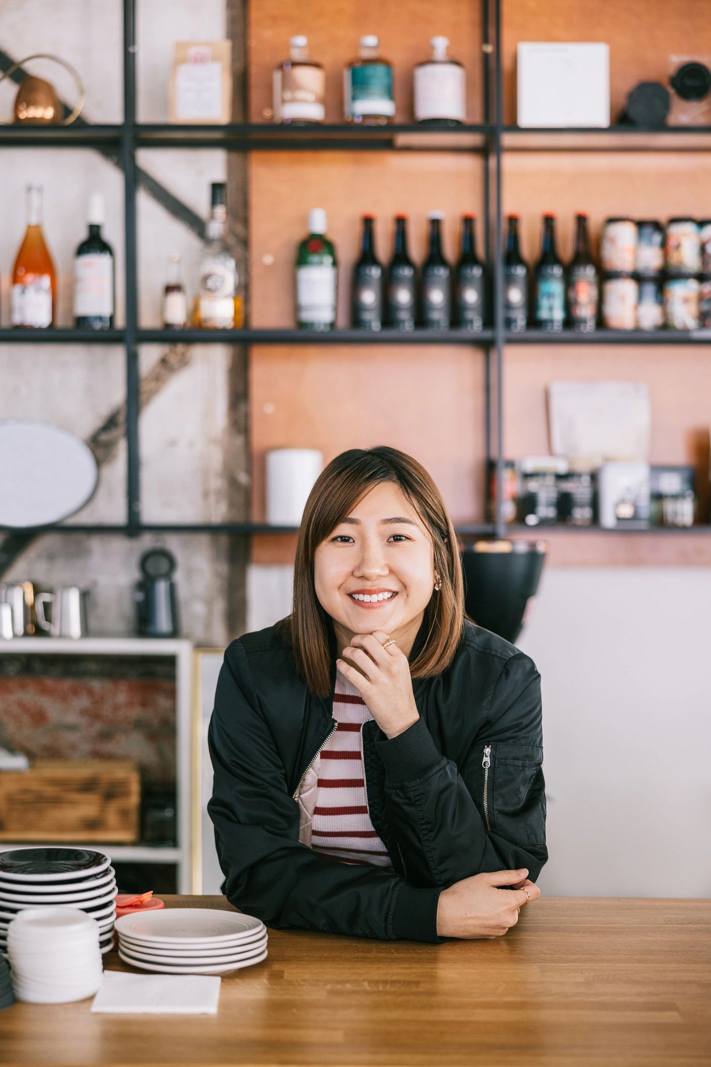 Stylish café team member in a warm interior